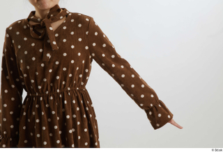 Aera  1 arm brown dots dress casual dressed flexing…